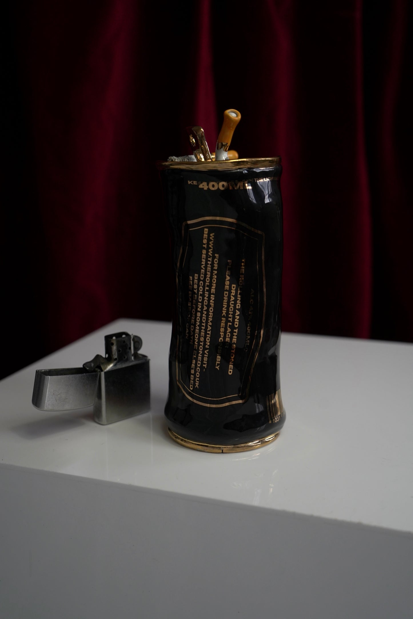 COUPLE OF CIGARETTES BEER CAN