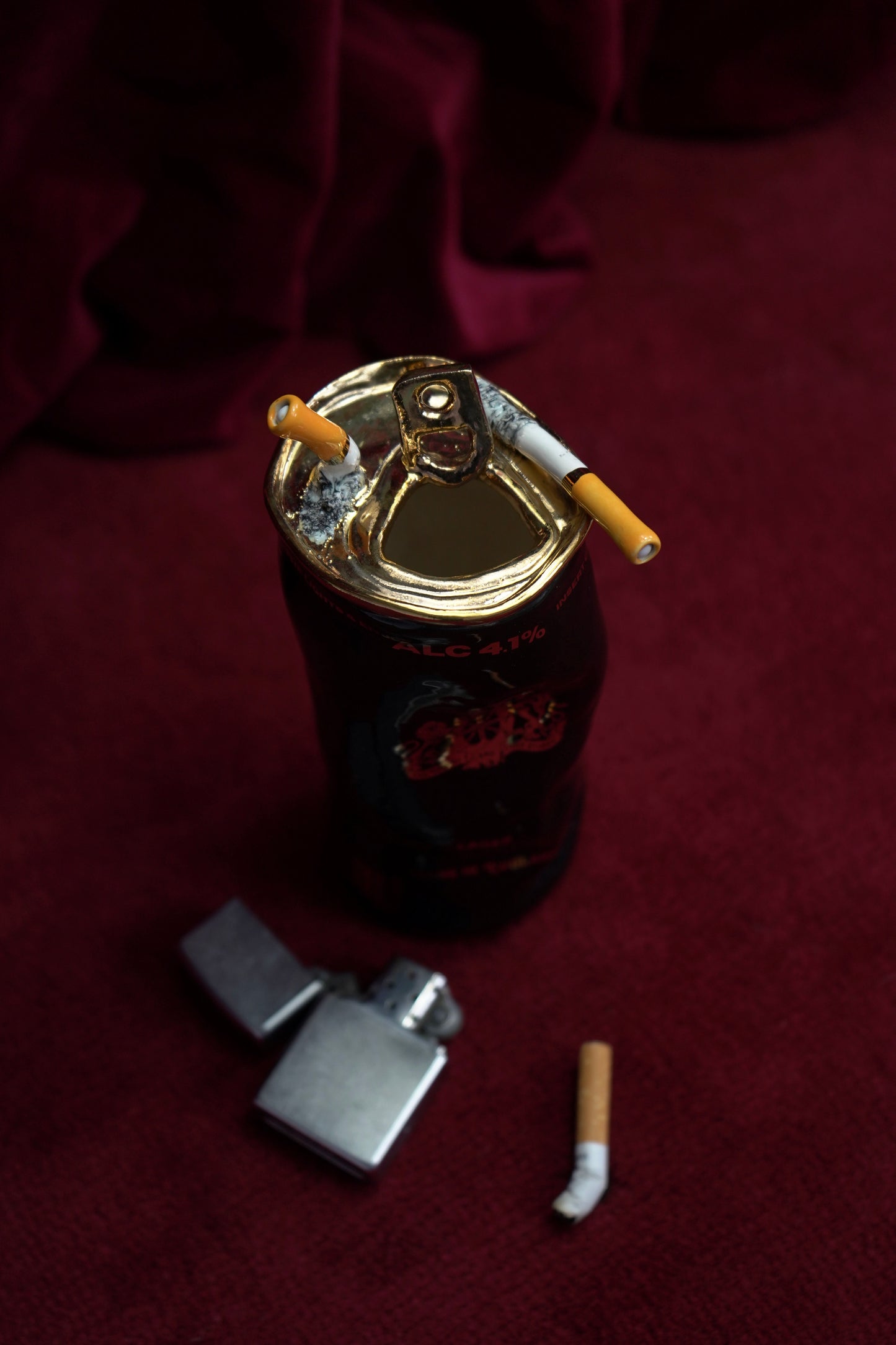 COUPLE OF CIGARETTES BEER CAN