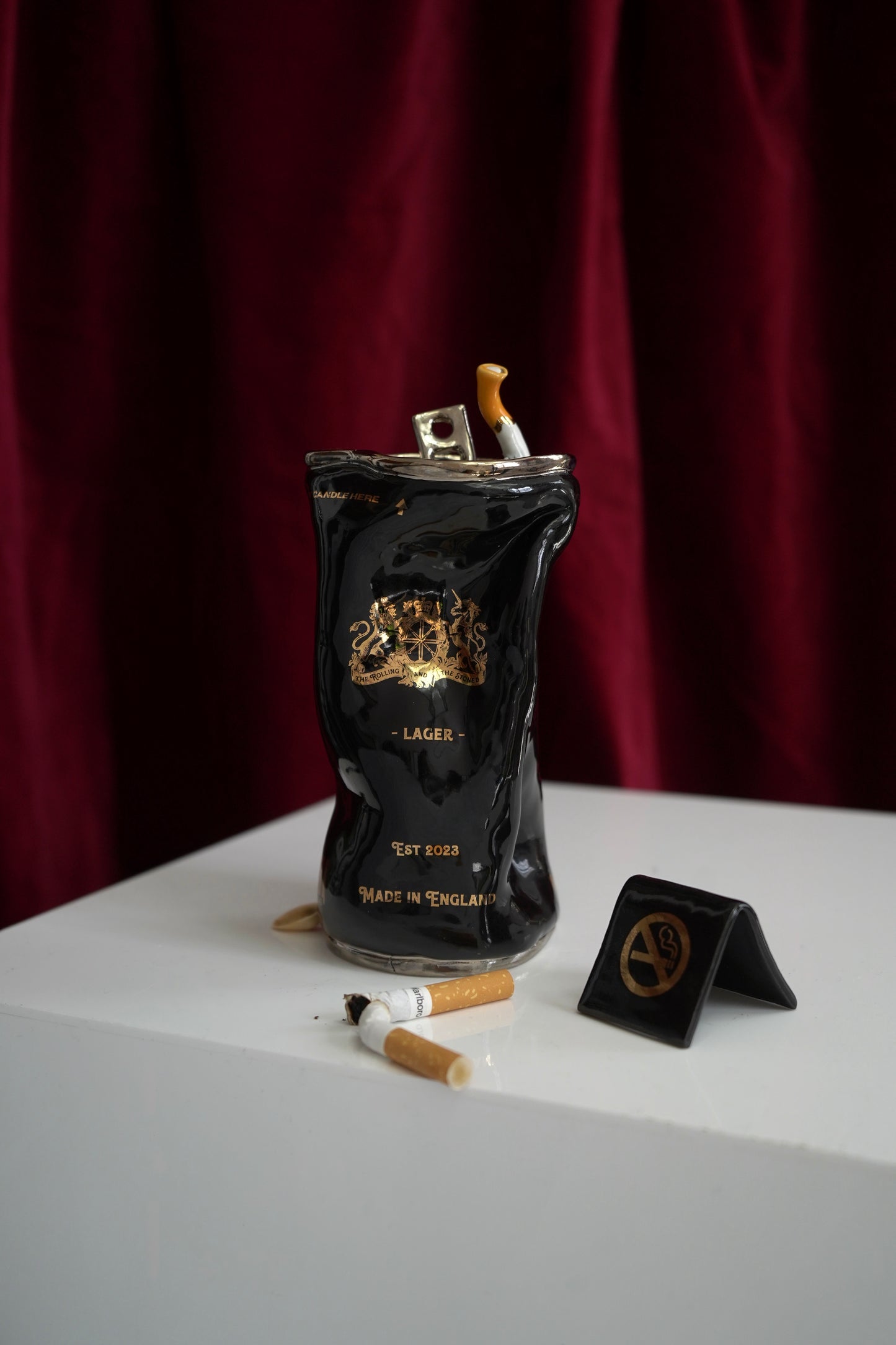SILVER STUBBED OUT CIGARETTE BEER CAN