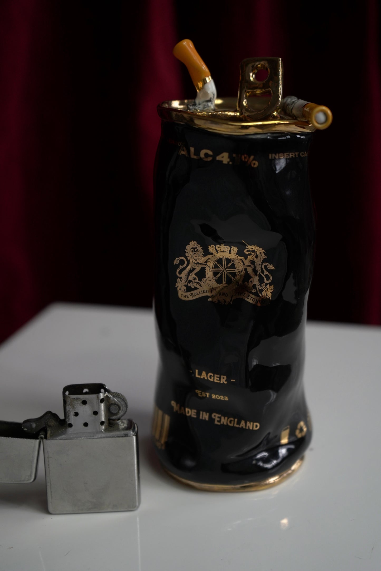 COUPLE OF CIGARETTES BEER CAN