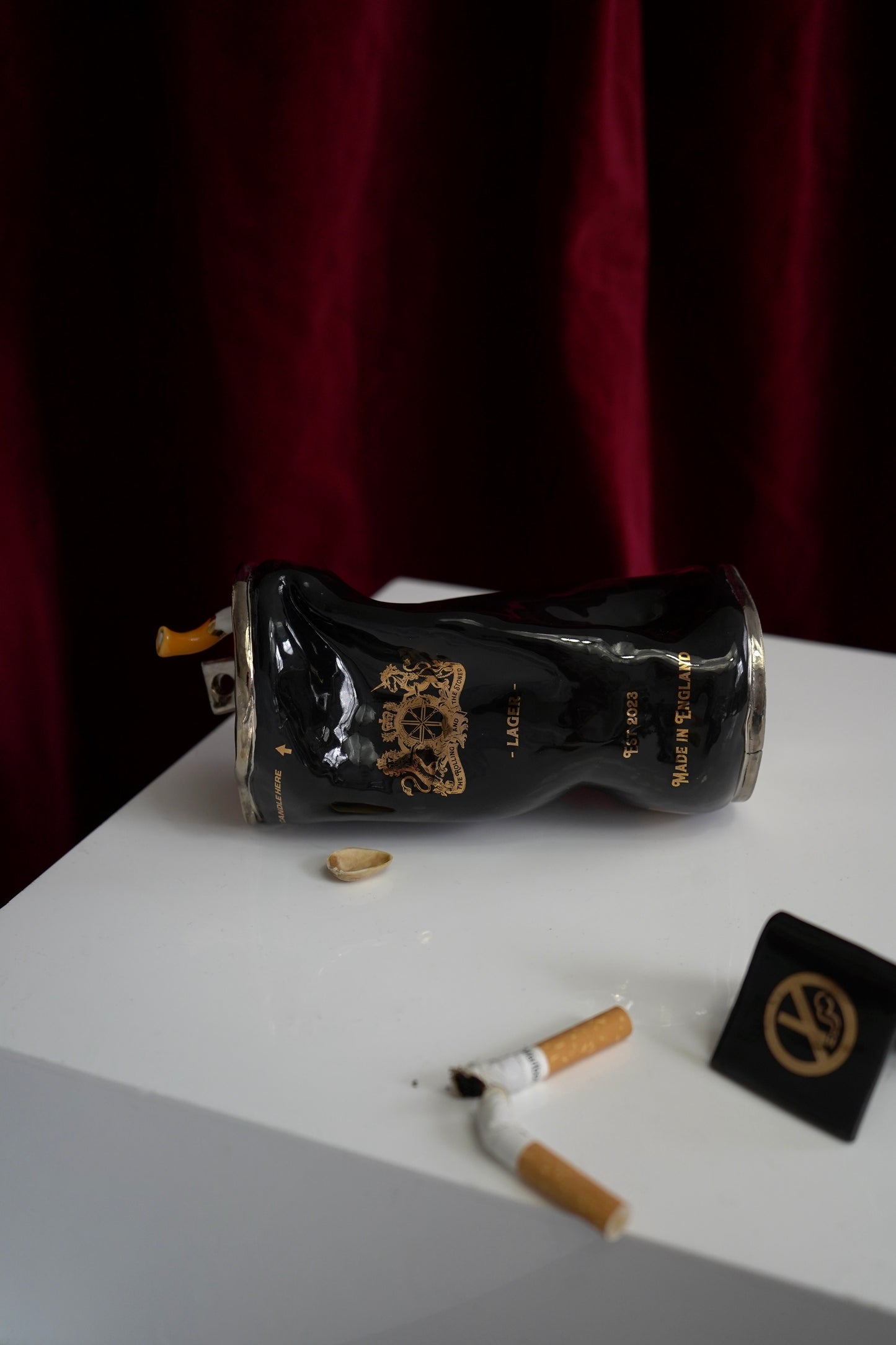 SILVER STUBBED OUT CIGARETTE BEER CAN