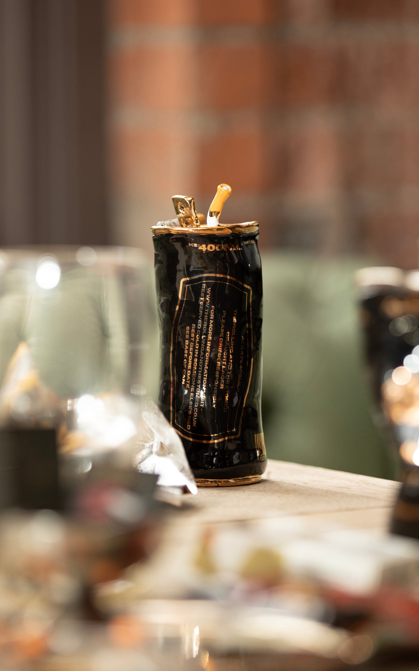 COUPLE OF CIGARETTES BEER CAN
