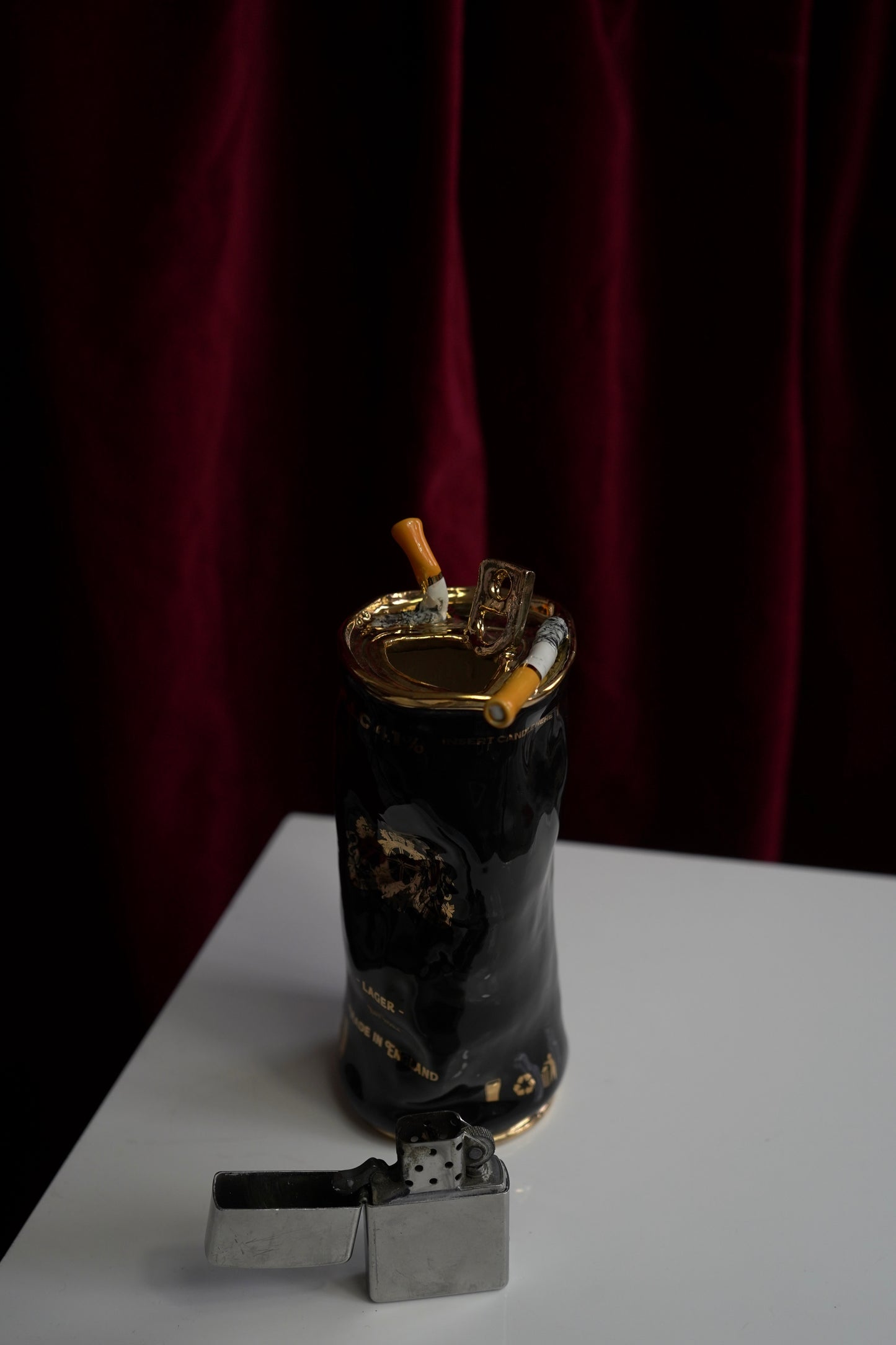 COUPLE OF CIGARETTES BEER CAN