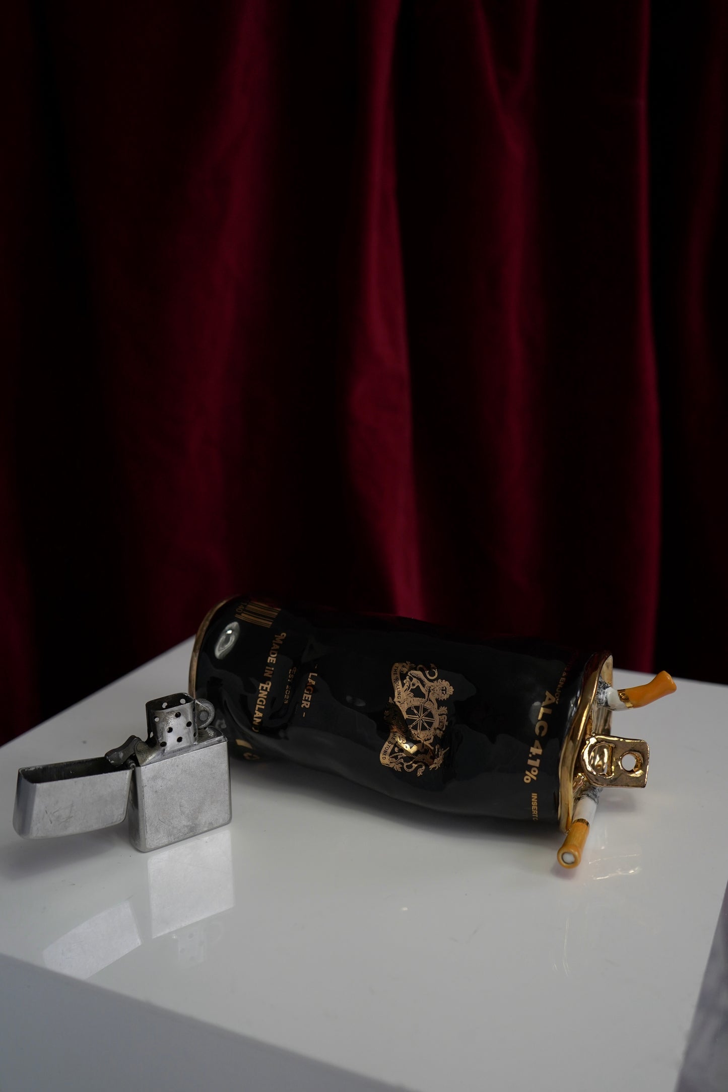 COUPLE OF CIGARETTES BEER CAN