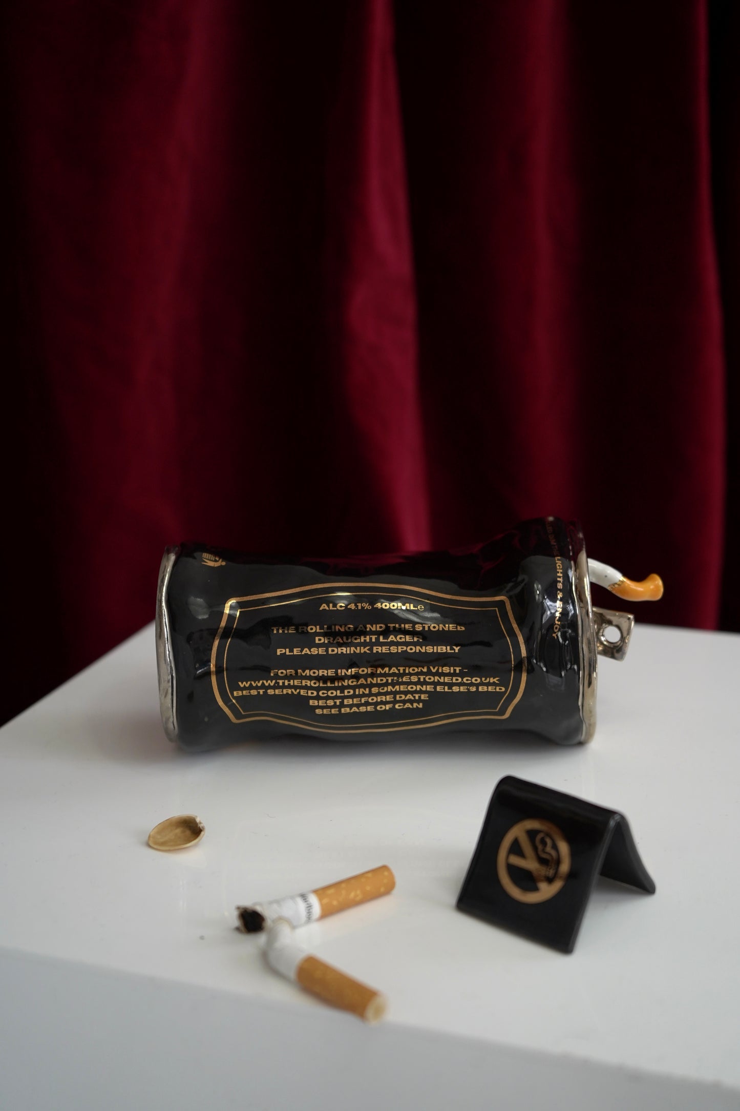 SILVER STUBBED OUT CIGARETTE BEER CAN