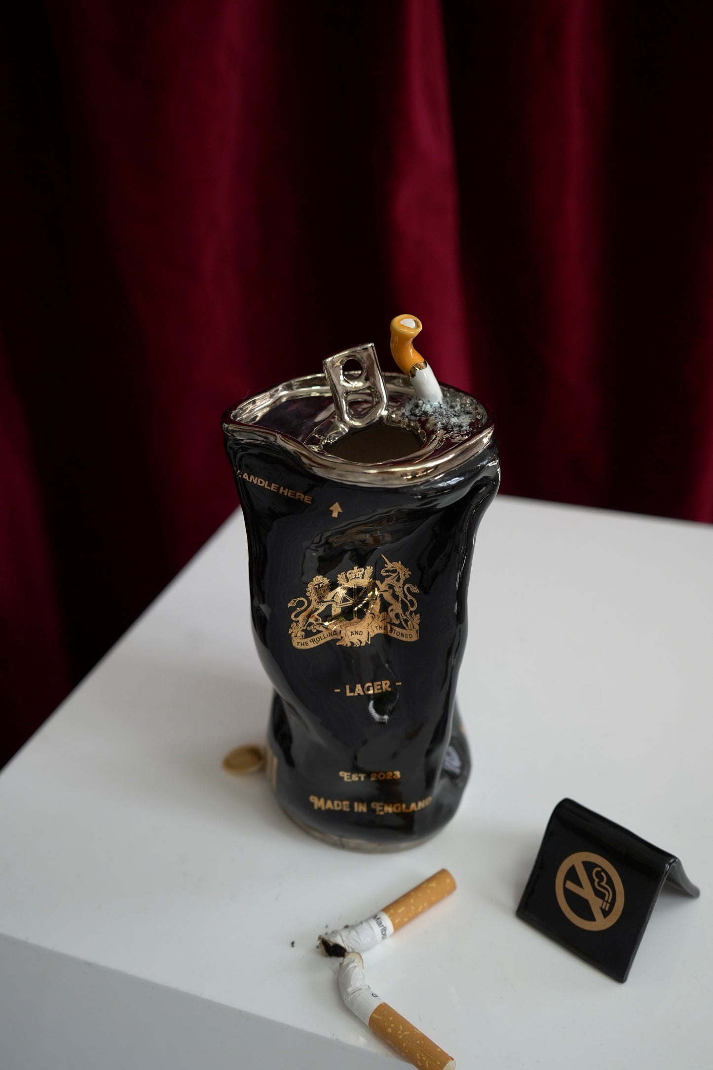 SILVER STUBBED OUT CIGARETTE BEER CAN