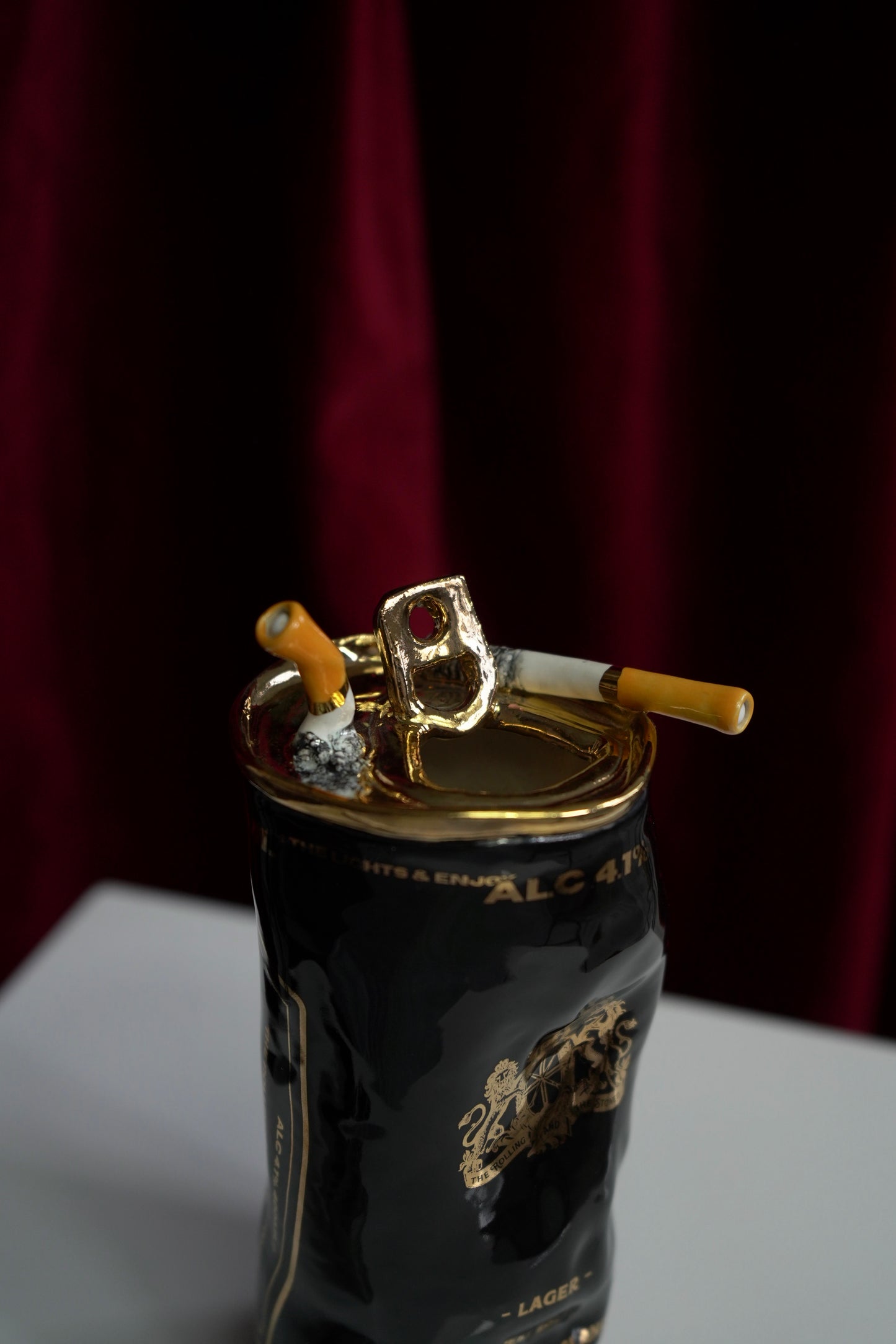 COUPLE OF CIGARETTES BEER CAN