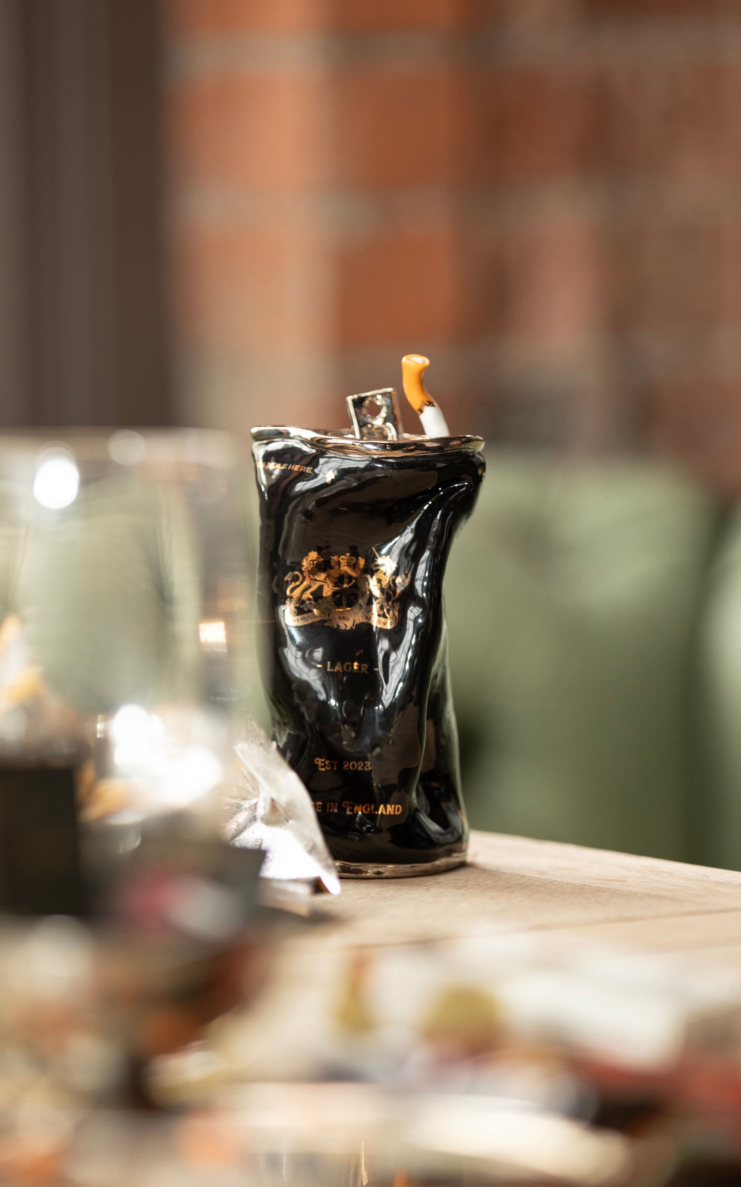 SILVER STUBBED OUT CIGARETTE BEER CAN